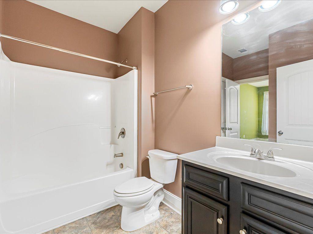 80 Lanier Ridge Acworth, GA 30101 - Photo 14 of 59 a bathroom with a sink a toilet and shower