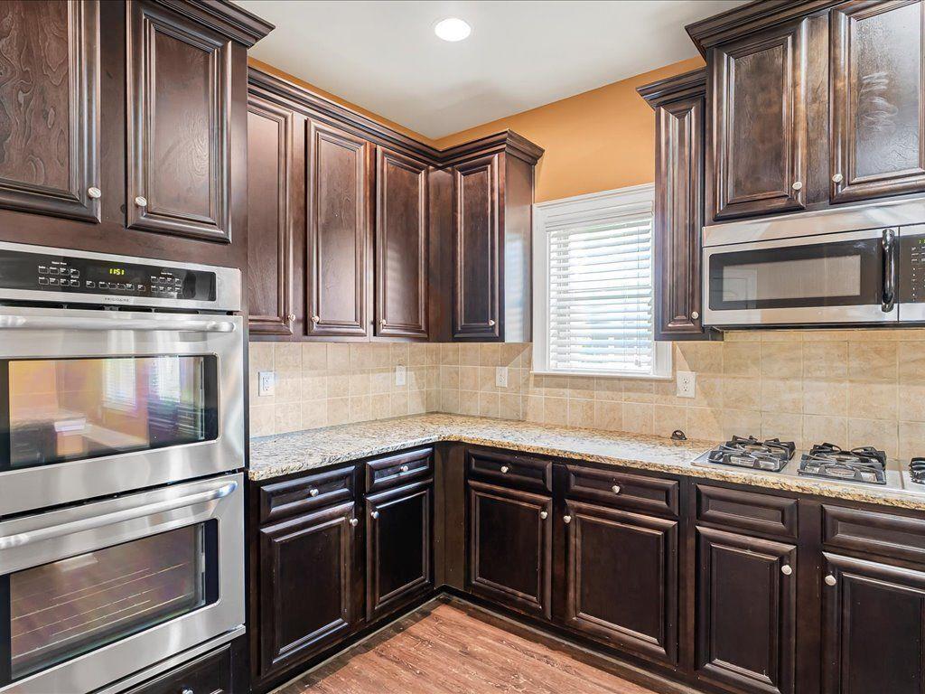 80 Lanier Ridge Acworth, GA 30101 - Photo 15 of 59 a kitchen with granite countertop stainless steel appliances and wooden cabinets