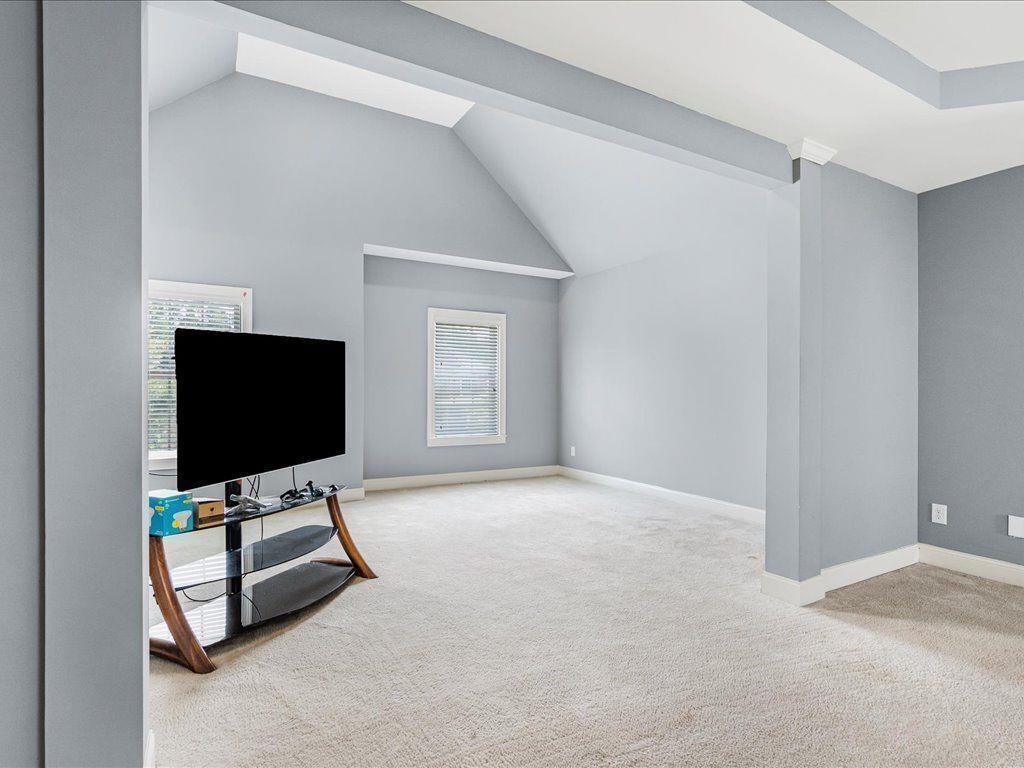80 Lanier Ridge Acworth, GA 30101 - Photo 33 of 59 a living room with couch and a flat screen tv