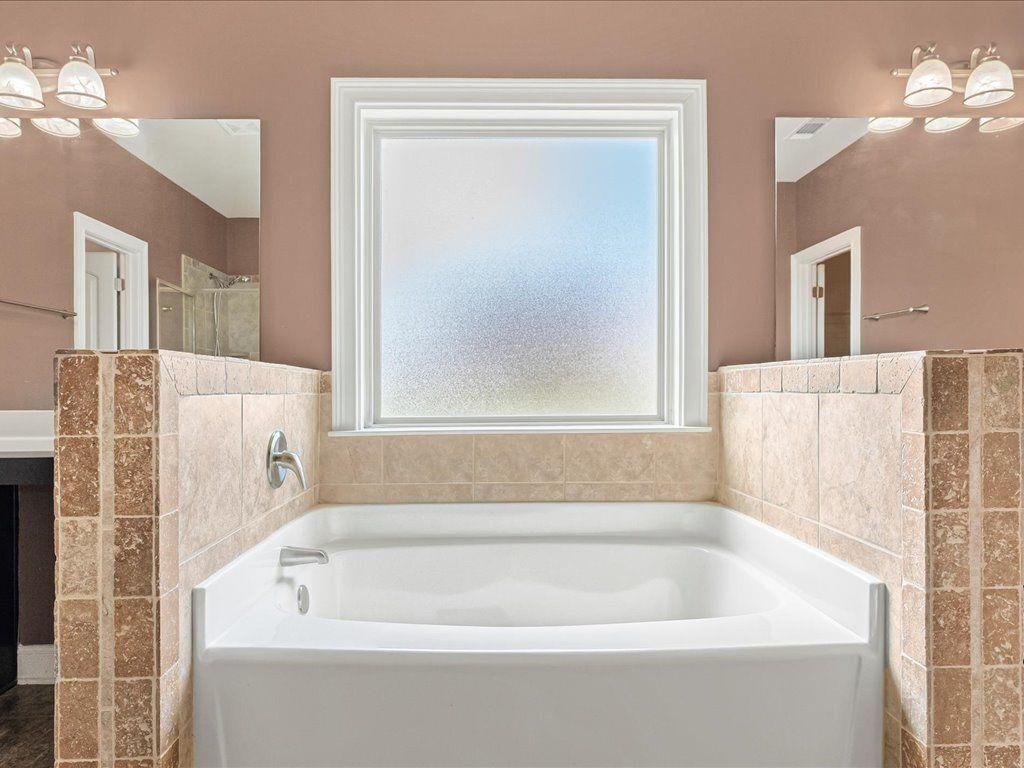 80 Lanier Ridge Acworth, GA 30101 - Photo 39 of 59 a bathroom with a bathtub and a shower
