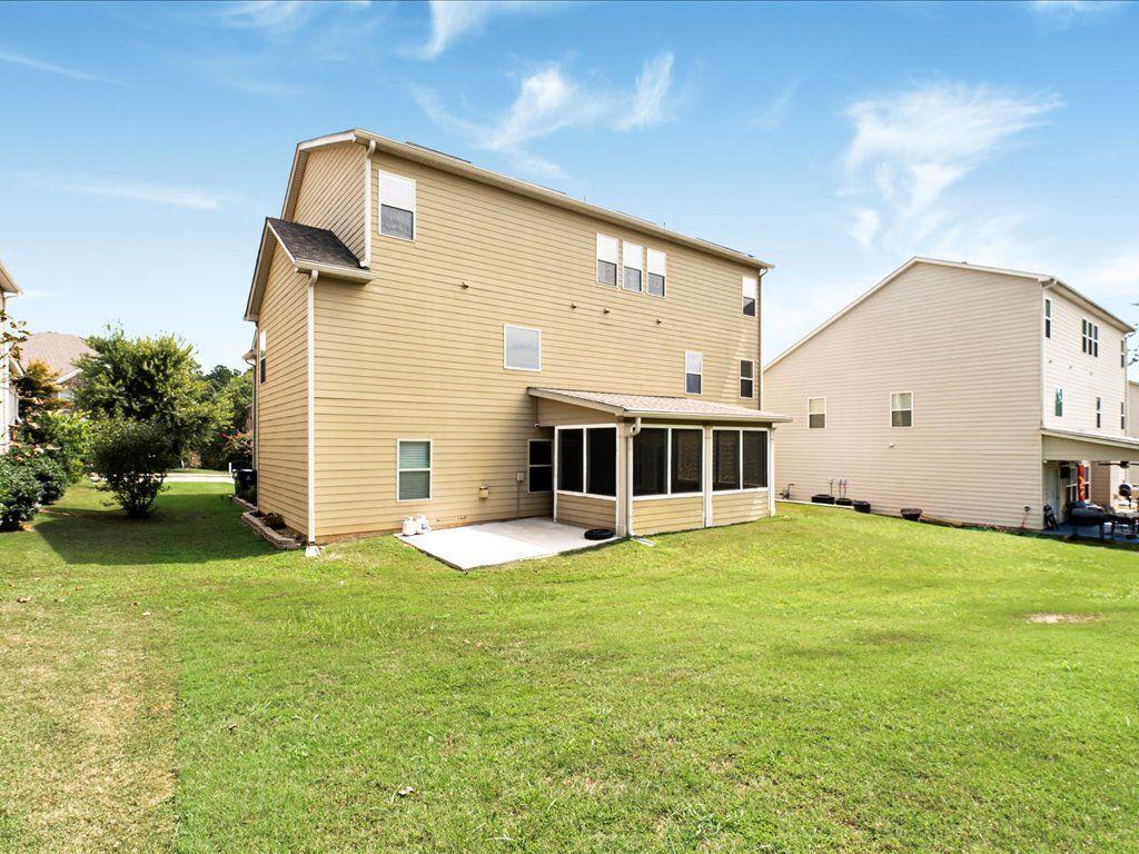 80 Lanier Ridge Acworth, GA 30101 - Photo 56 of 59 a front view of a house with a yard and garage