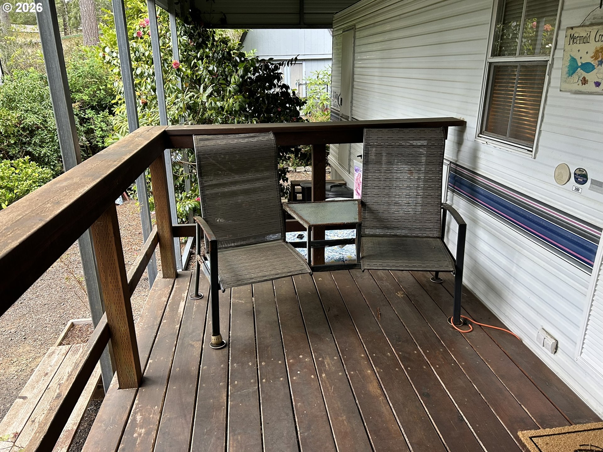 112 Sailor Lane Florence, OR 97439 - Photo 12 of 44 a view of balcony with wooden floor and outdoor seating