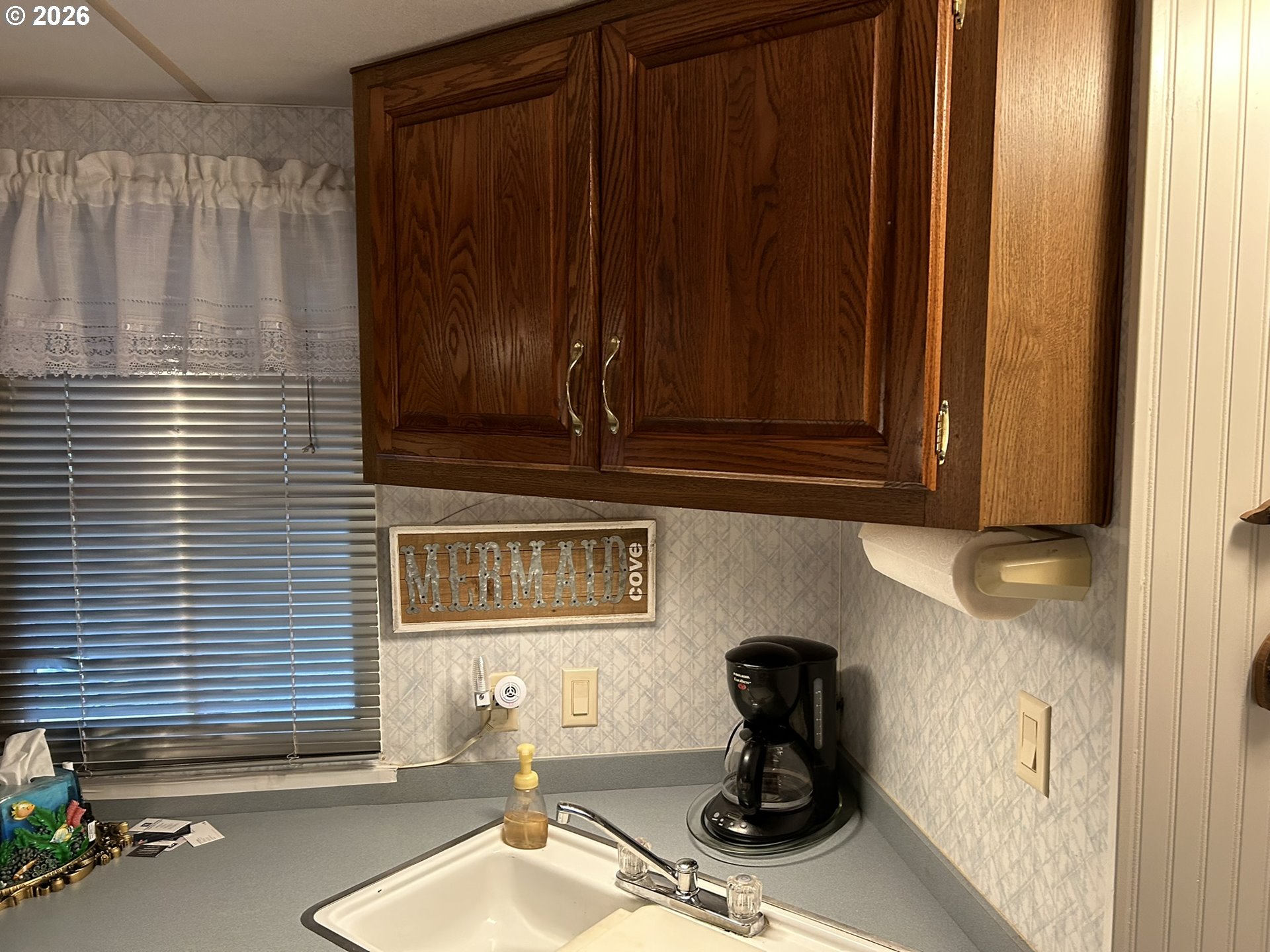 112 Sailor Lane Florence, OR 97439 - Photo 16 of 44 a kitchen with a sink and a window