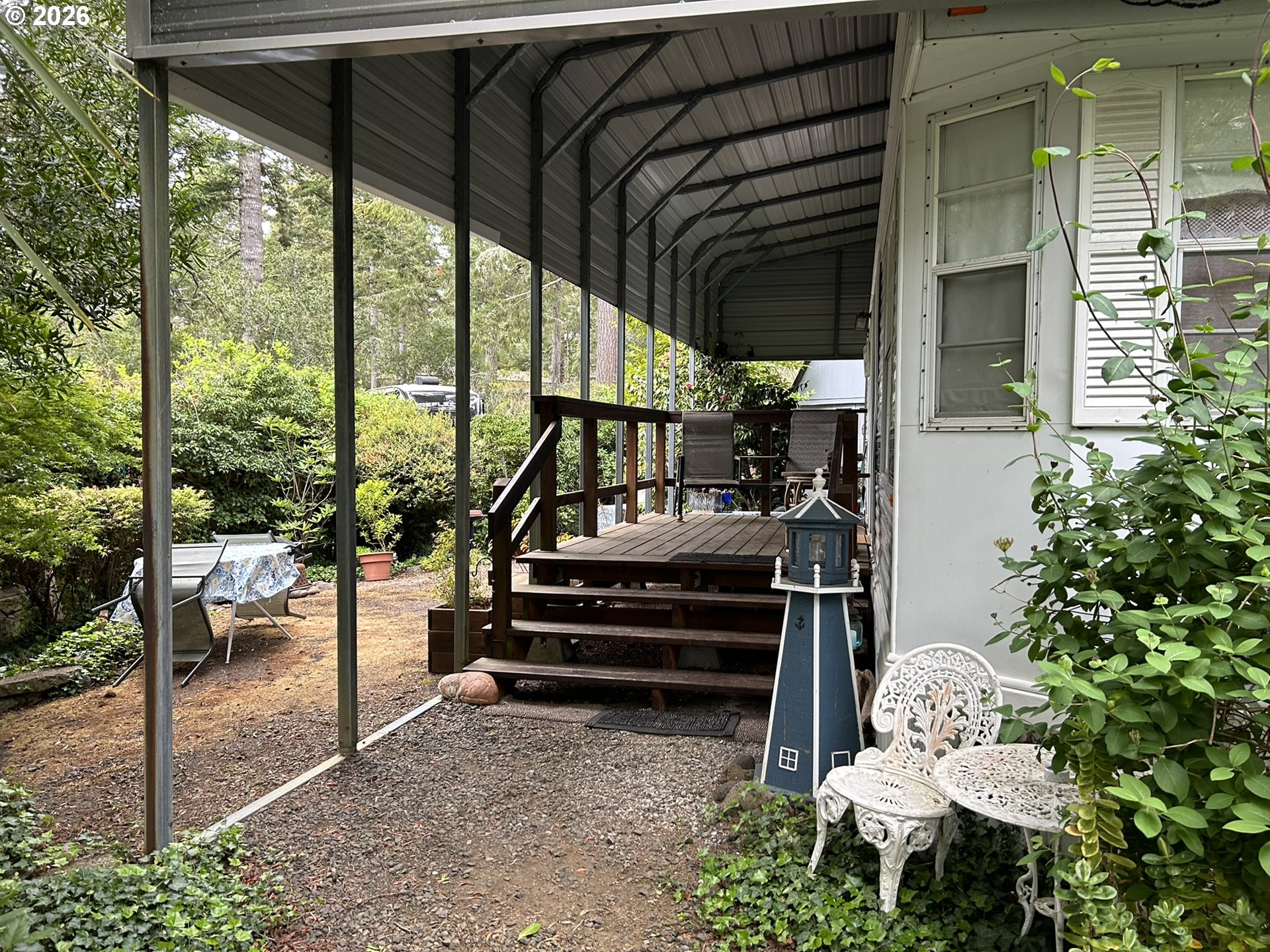 112 Sailor Lane Florence, OR 97439 - Photo 2 of 44 a view of balcony with chairs and a potted plant