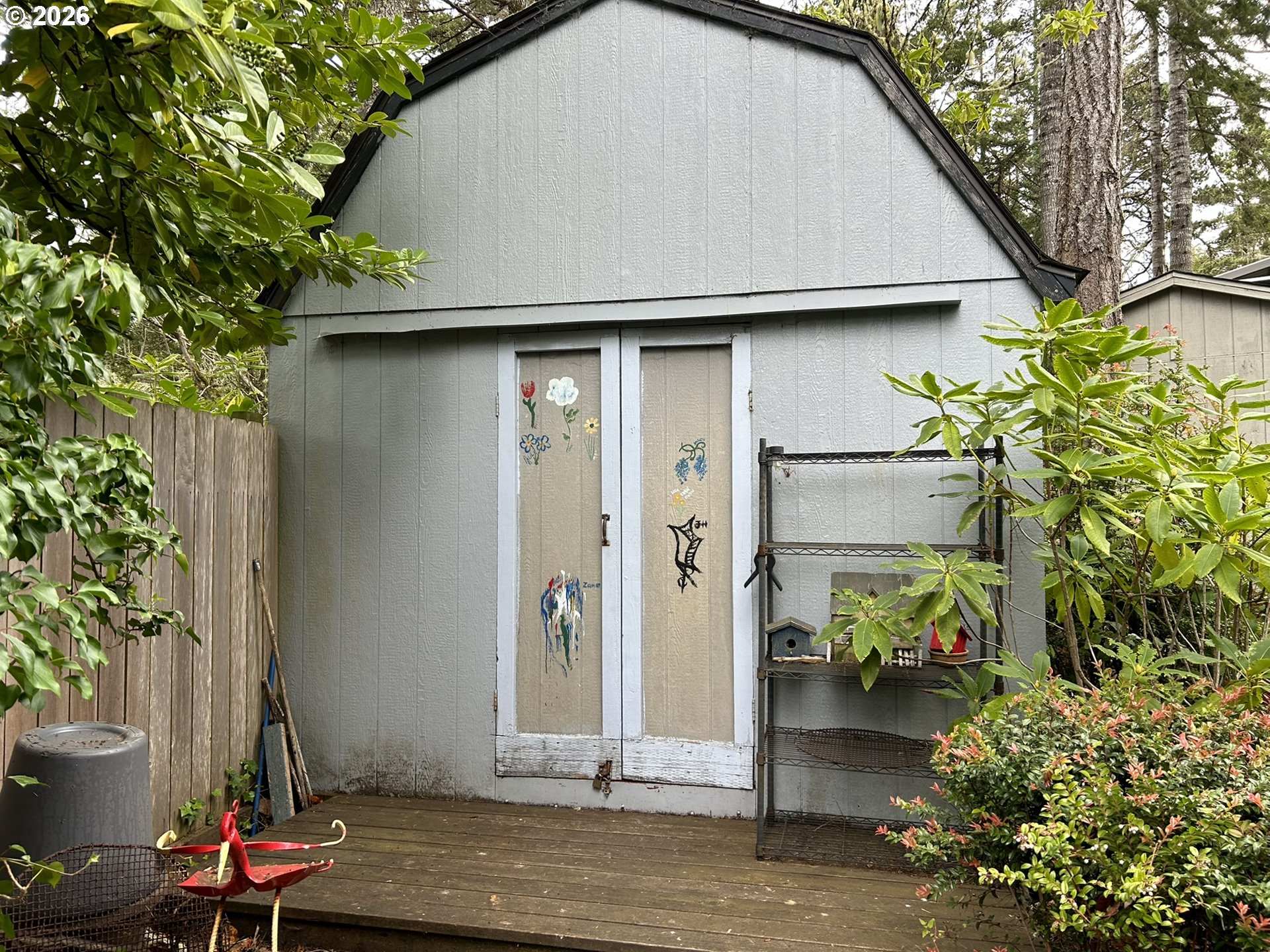 112 Sailor Lane Florence, OR 97439 - Photo 10 of 44 a backyard of a house with lots of green space