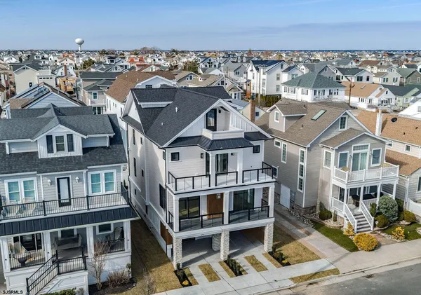an aerial view of a house with a ocean view
