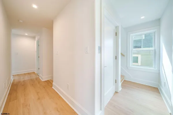 a view of hallway with windows