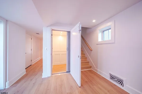 a view of entryway with wooden floor