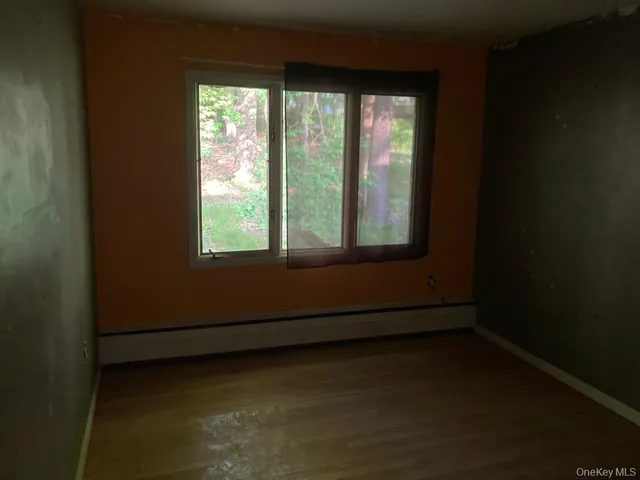 a view of a room that has a window
