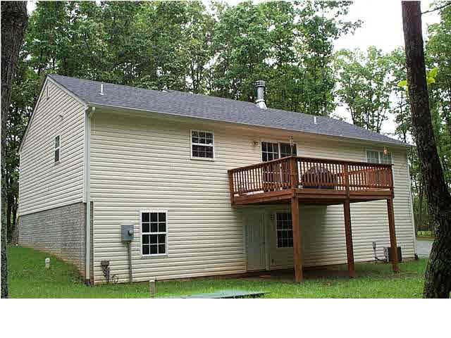 0 Gladiola Road, Unit Q25 Ruckersville, VA 22968 - Photo 4 of 4 a view of a house with a small yard and a large tree