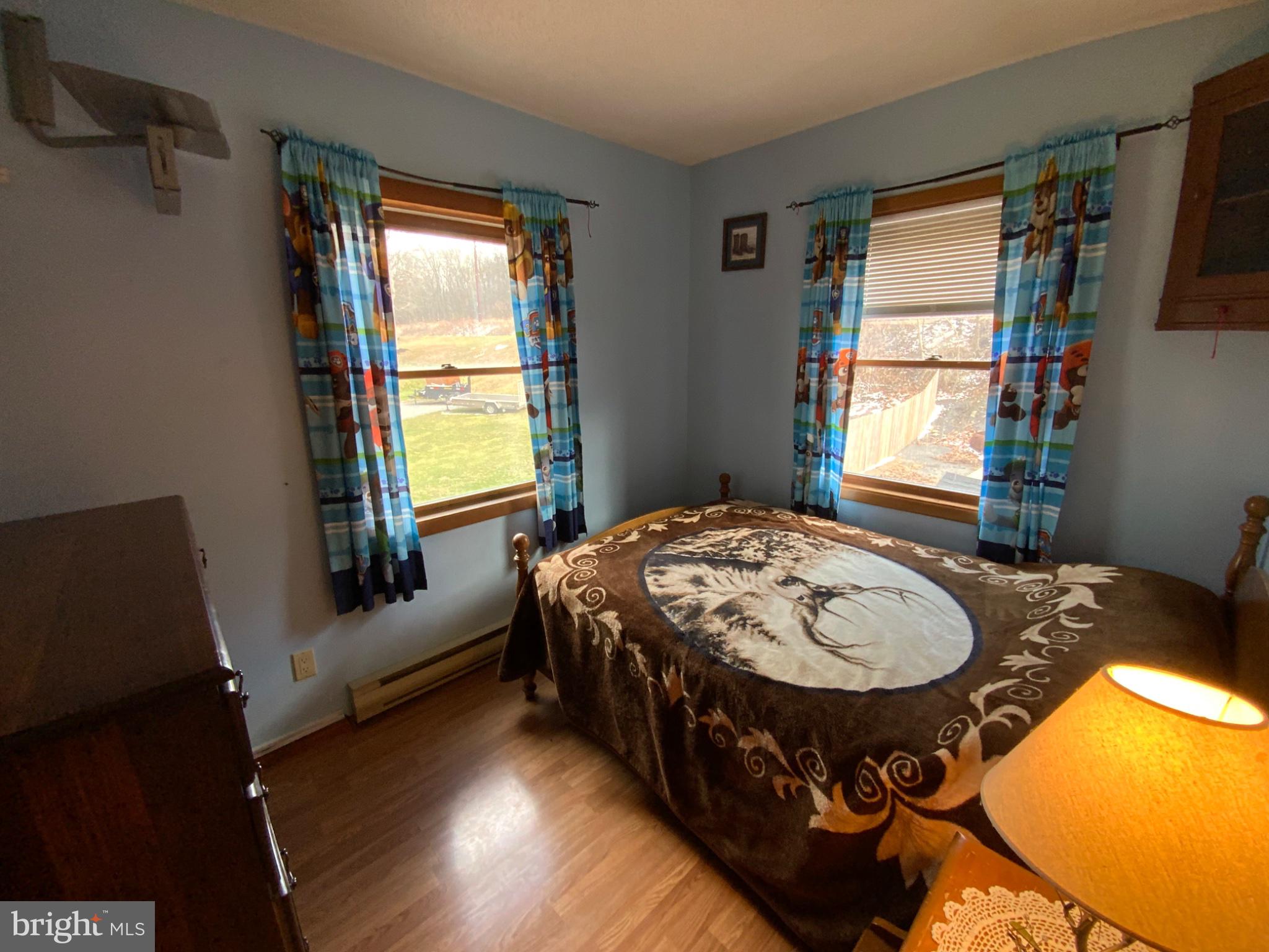 1682 Youngdale Road Lock Haven, PA 17745 - Photo 19 of 36 Cozy bedroom with vibrant decor.