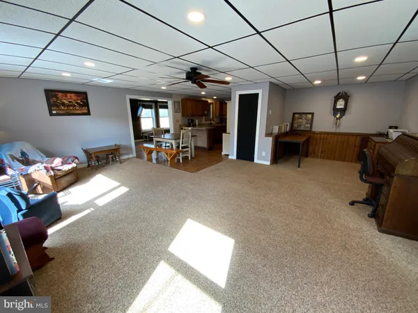 a view of a livingroom with furniture and a garage