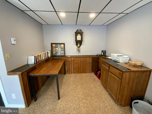 a kitchen with stainless steel appliances granite countertop a sink a stove top oven a counter space and cabinets