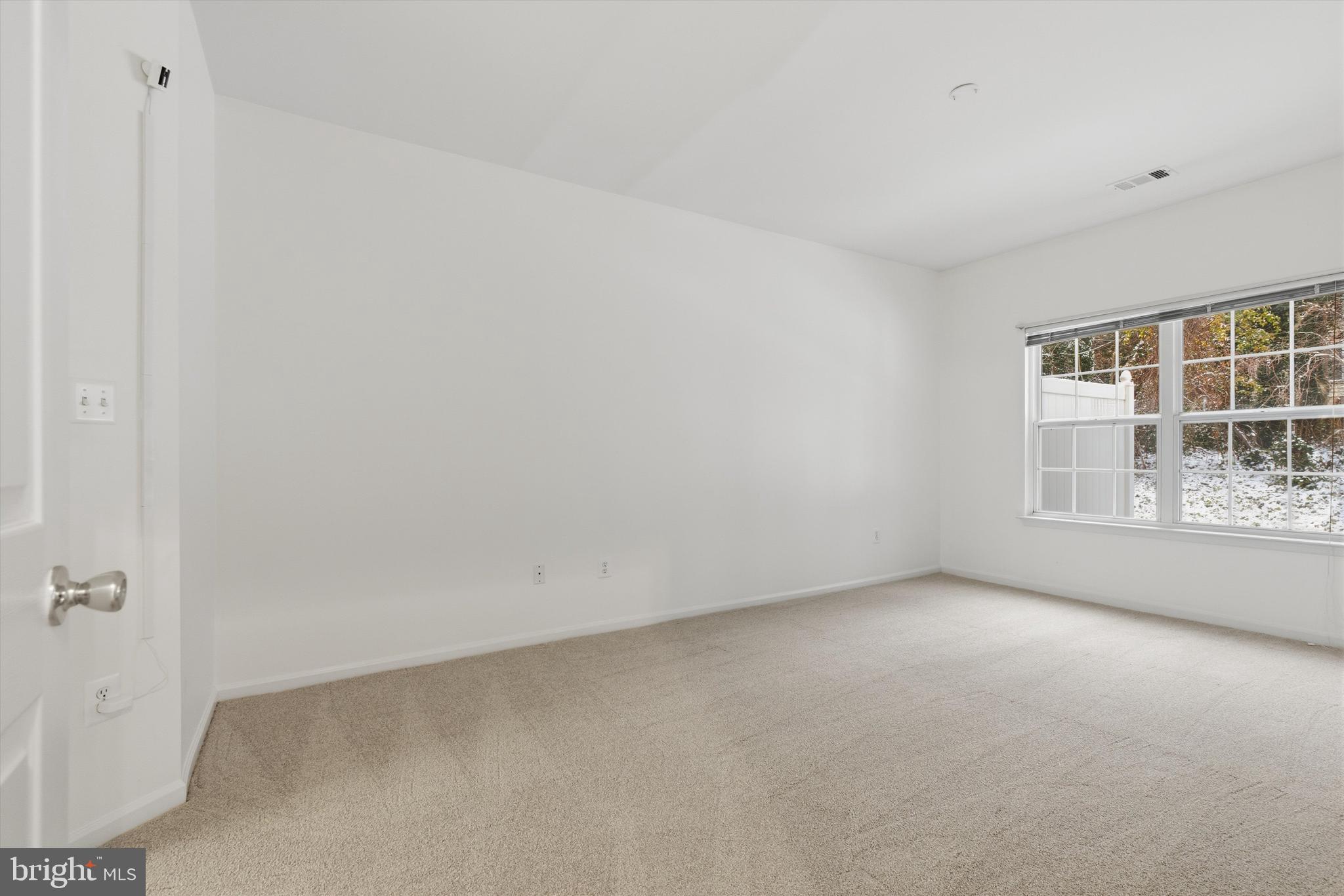 1640 Fallowfield Court, Unit 1640 Crofton, MD 21114 - Photo 12 of 27 a view of an empty room with a window