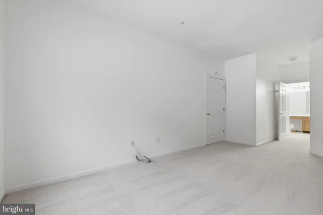a bathroom with a tub a mirror and shower