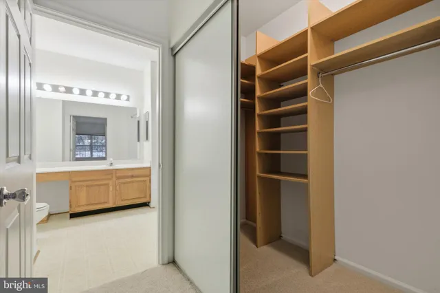 a bathroom with a bathtub a sink and a mirror