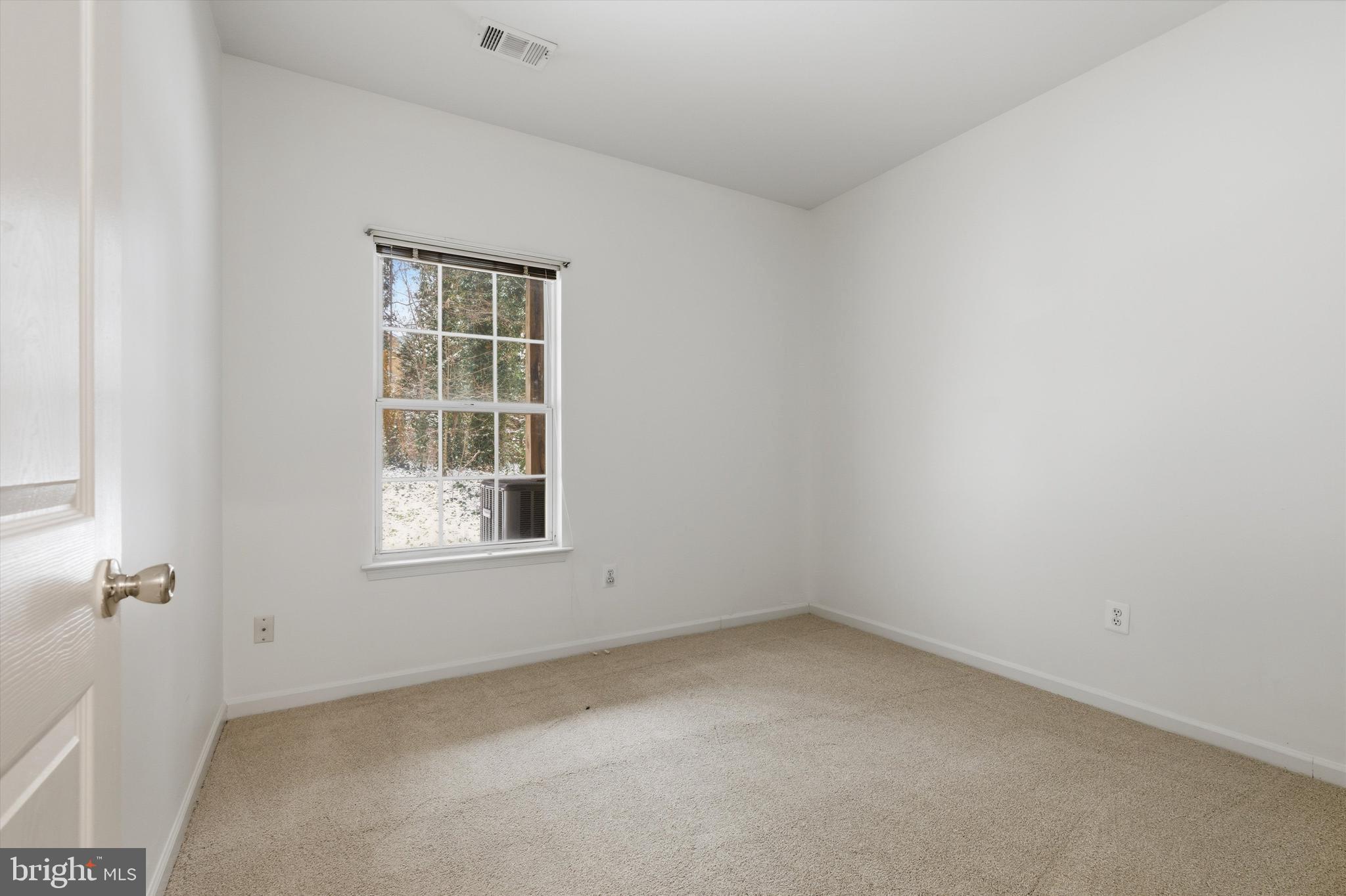 1640 Fallowfield Court, Unit 1640 Crofton, MD 21114 - Photo 16 of 27 an empty room with a window