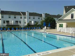 1640 Fallowfield Court, Unit 1640 Crofton, MD 21114 - Photo 26 of 27 a view of swimming pool with outdoor seating