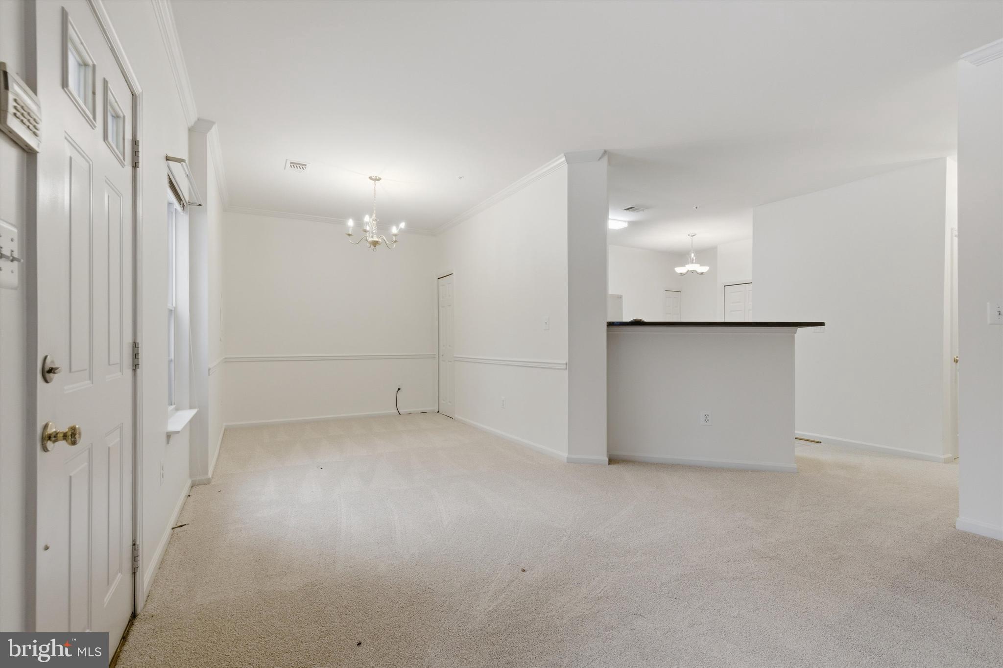 1640 Fallowfield Court, Unit 1640 Crofton, MD 21114 - Photo 7 of 27 an empty room with a cabinet and mirrors
