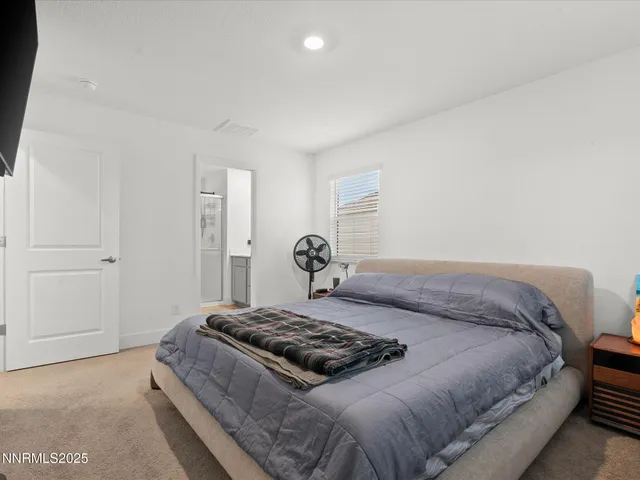 a bedroom with a bed and a cabinets