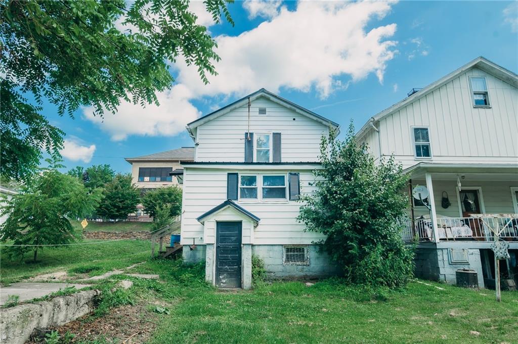 452 Washington Street Indiana, PA 15701 - Photo 5 of 28 a front view of a house with a yard and trees