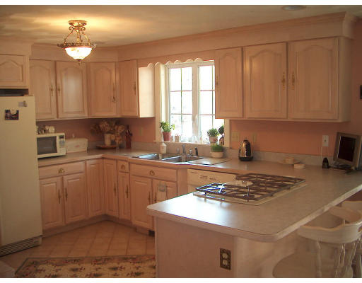 56 Emery Road Townsend, MA 01469 - Photo 6 of 7 a kitchen with a sink cabinets and window
