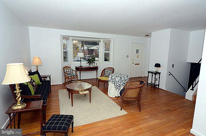 12514 Littleton Street Silver Spring, MD 20906 - Photo 2 of 29 a living room with furniture and wooden floor