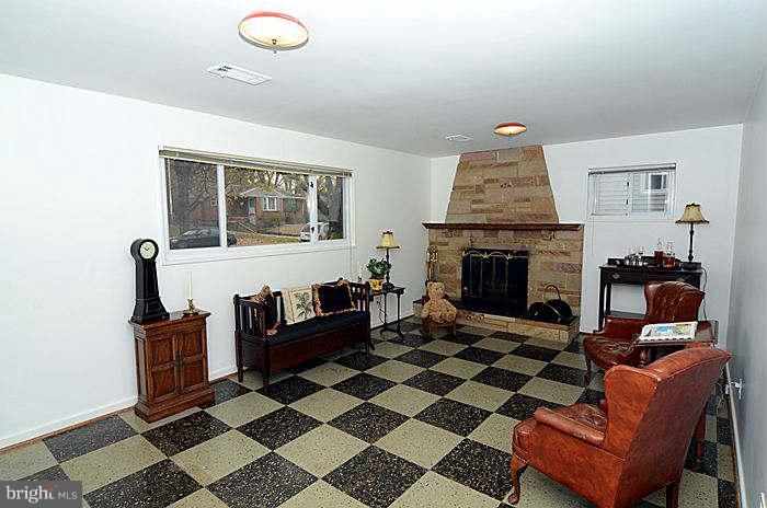 12514 Littleton Street Silver Spring, MD 20906 - Photo 14 of 29 a living room with furniture and a fireplace