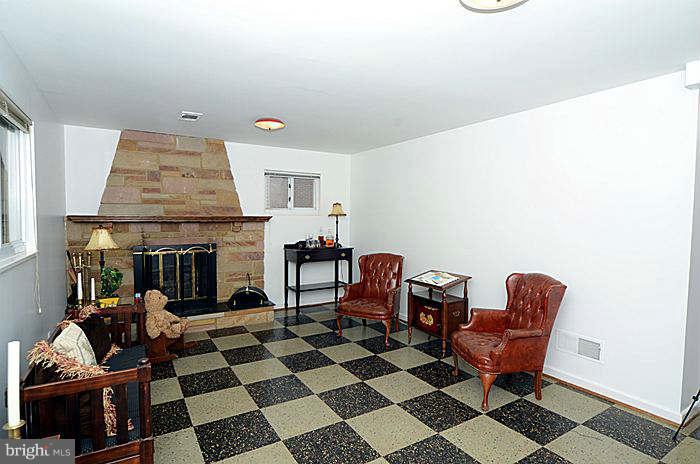 12514 Littleton Street Silver Spring, MD 20906 - Photo 15 of 29 a living room with furniture and a fireplace