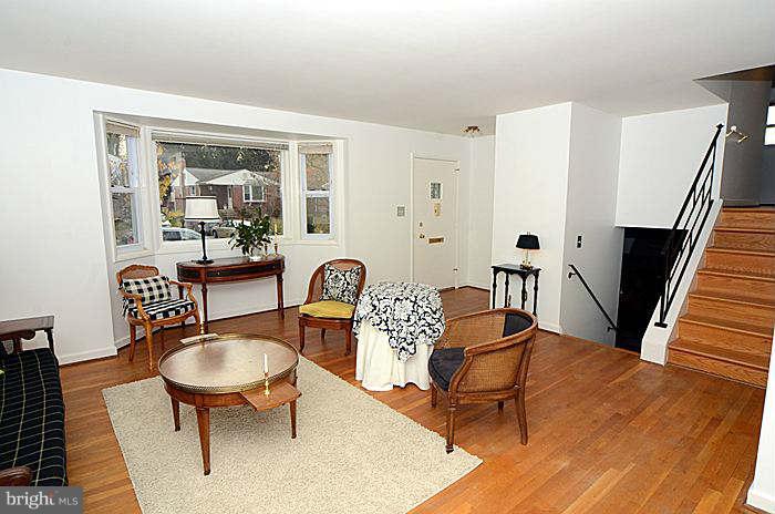 12514 Littleton Street Silver Spring, MD 20906 - Photo 3 of 29 a living room with furniture and wooden floor