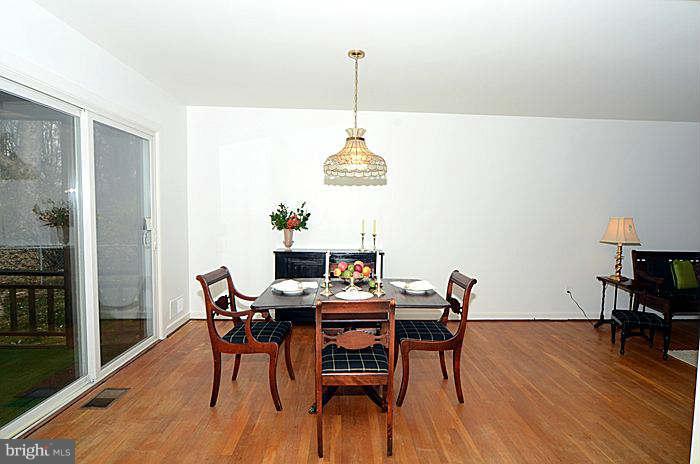 12514 Littleton Street Silver Spring, MD 20906 - Photo 6 of 29 a view of a dining room with furniture and wooden floor