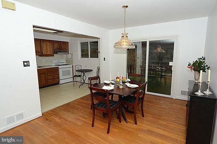 12514 Littleton Street Silver Spring, MD 20906 - Photo 7 of 29 a view of a dining room with furniture window and wooden floor