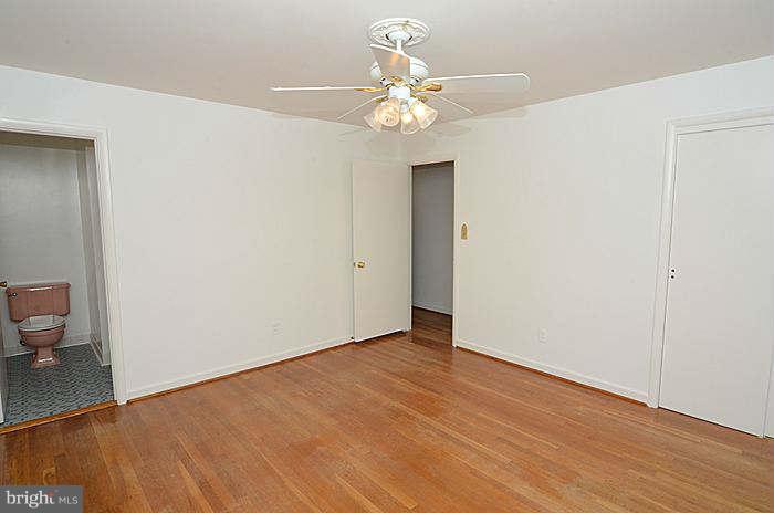 12514 Littleton Street Silver Spring, MD 20906 - Photo 9 of 29 a view of an empty room with wooden floor