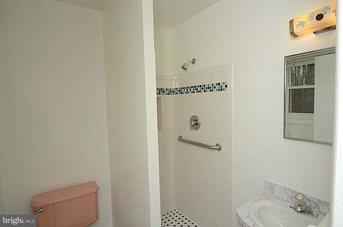 12514 Littleton Street Silver Spring, MD 20906 - Photo 10 of 29 a bathroom with a toilet and a sink