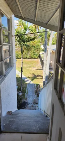 a view of balcony with wooden floor