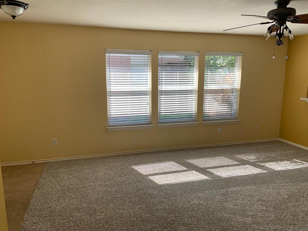2620 Caprock Road McKinney, TX 75071 - Photo 18 of 19 Unfurnished room featuring a ceiling fan, light carpet, and light tile patterned floors