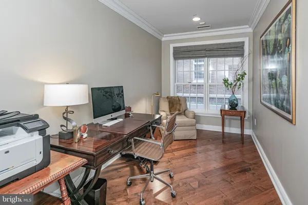 a workspace with furniture and wooden floor