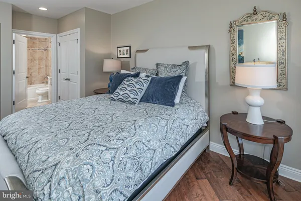 a bedroom with a bed and a table in it