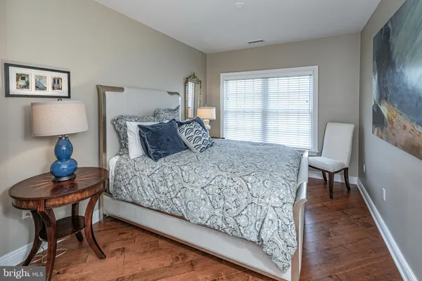 a bedroom with a bed and a table in it
