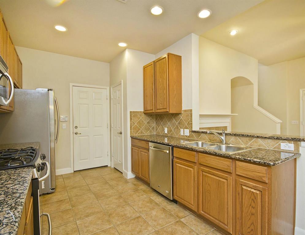 14812 Avery Ranch Boulevard, Unit 16 Austin, TX 78717 - Photo 14 of 32 a bathroom with a granite countertop sink and a mirror