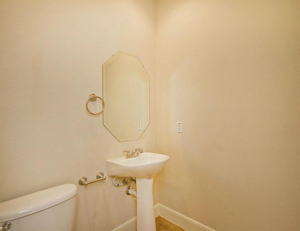 14812 Avery Ranch Boulevard, Unit 16 Austin, TX 78717 - Photo 15 of 32 a bathroom with a sink and mirror