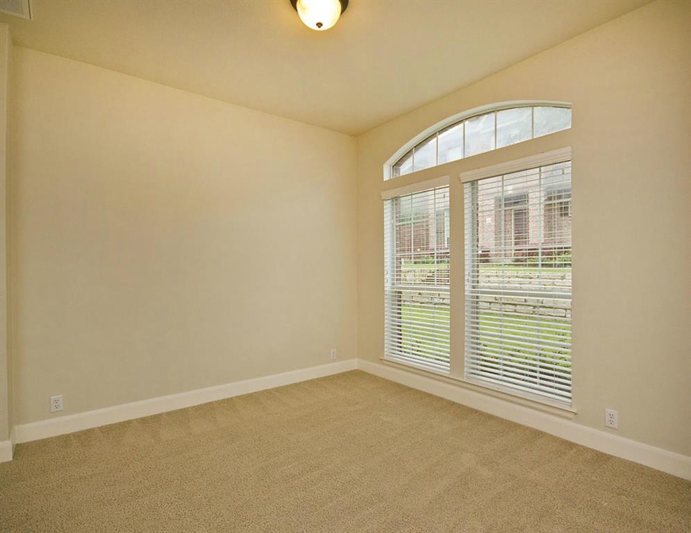 14812 Avery Ranch Boulevard, Unit 16 Austin, TX 78717 - Photo 16 of 32 an empty room with a empty space and windows