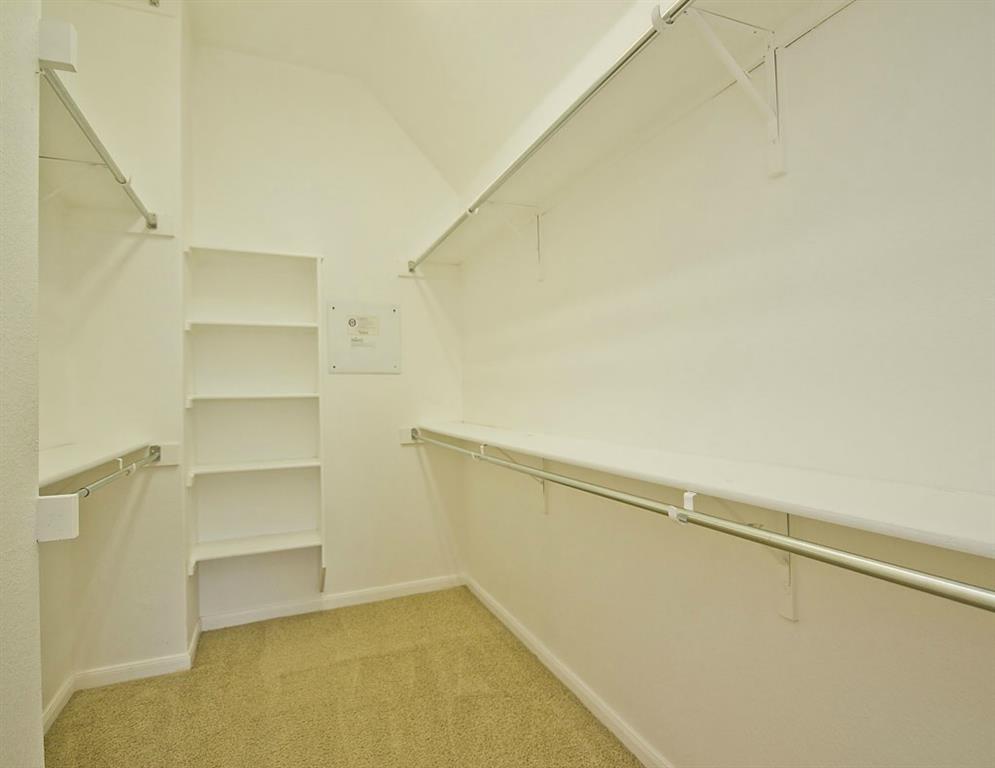 14812 Avery Ranch Boulevard, Unit 16 Austin, TX 78717 - Photo 23 of 32 a view of an empty walk in closet