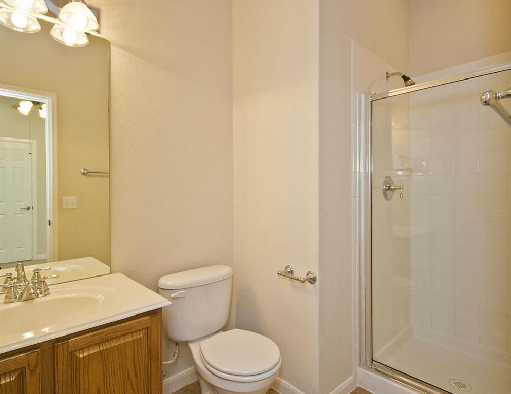 14812 Avery Ranch Boulevard, Unit 16 Austin, TX 78717 - Photo 26 of 32 a bathroom with a sink a toilet and shower