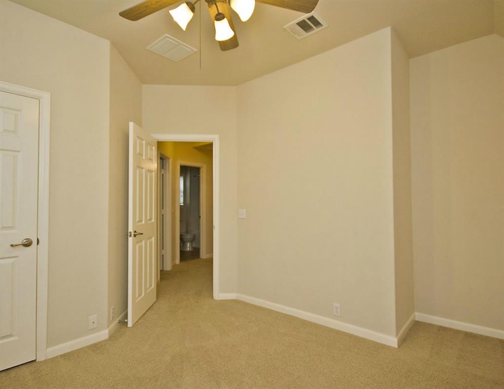 14812 Avery Ranch Boulevard, Unit 16 Austin, TX 78717 - Photo 28 of 32 a view of a hallway with a chandelier fan