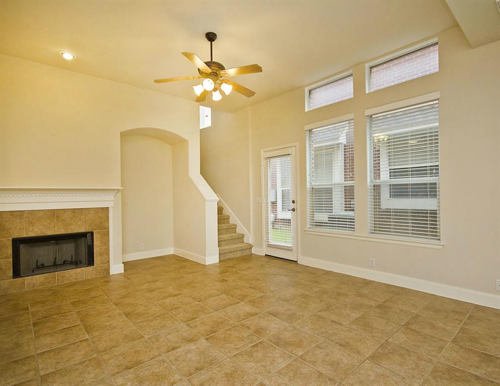 14812 Avery Ranch Boulevard, Unit 16 Austin, TX 78717 - Photo 10 of 32 a view of an empty room with a fireplace and a window
