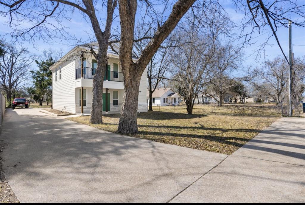 3309 South 3rd Street Waco, TX 76706 - Photo 2 of 31 a view of a yard with a house and trees