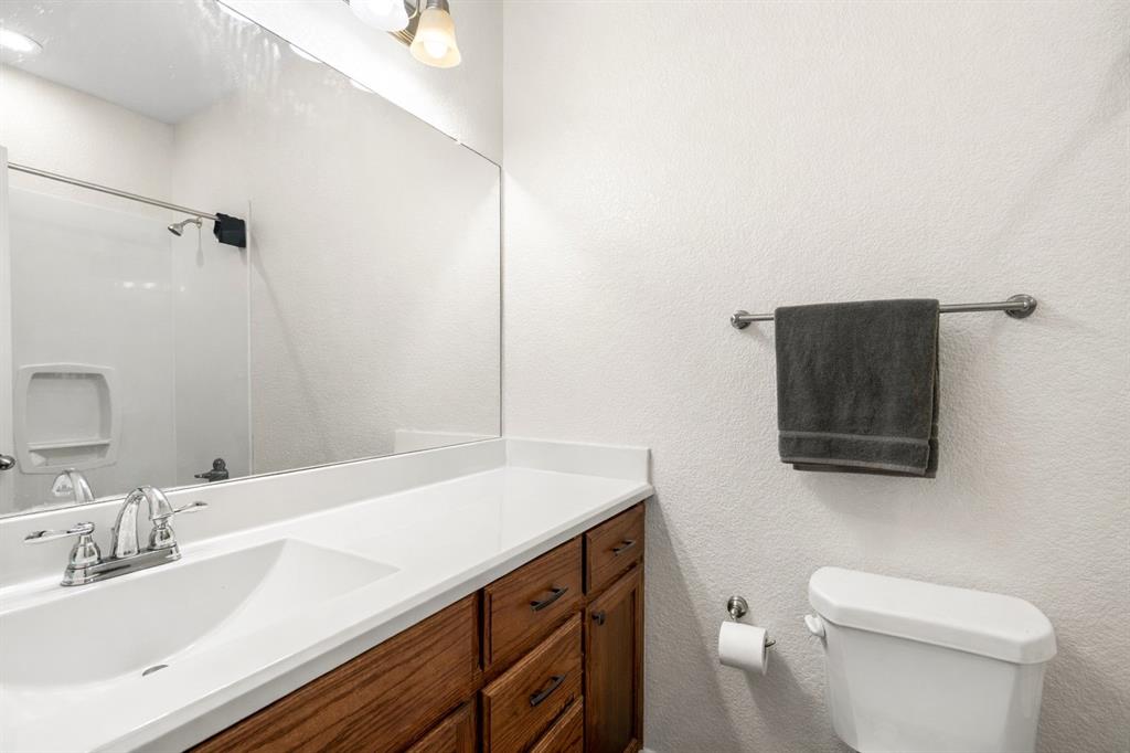 3309 South 3rd Street Waco, TX 76706 - Photo 21 of 31 a bathroom with a sink a toilet and mirror