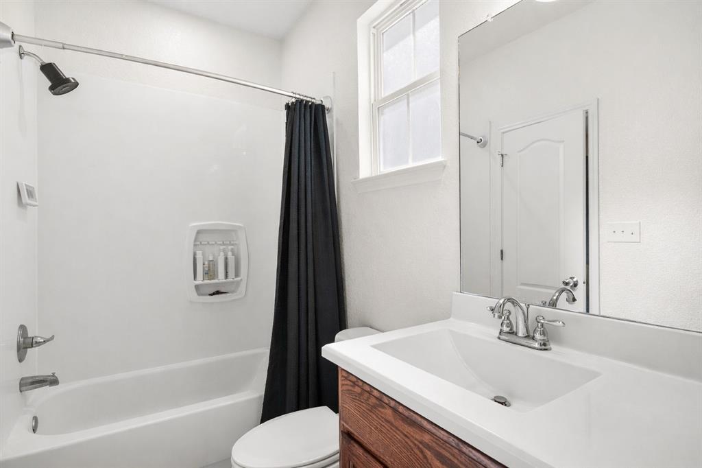 3309 South 3rd Street Waco, TX 76706 - Photo 22 of 31 a bathroom with a sink toilet and shower