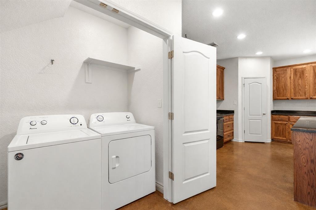 3309 South 3rd Street Waco, TX 76706 - Photo 24 of 31 a view of storage and utility room with washer and dryer